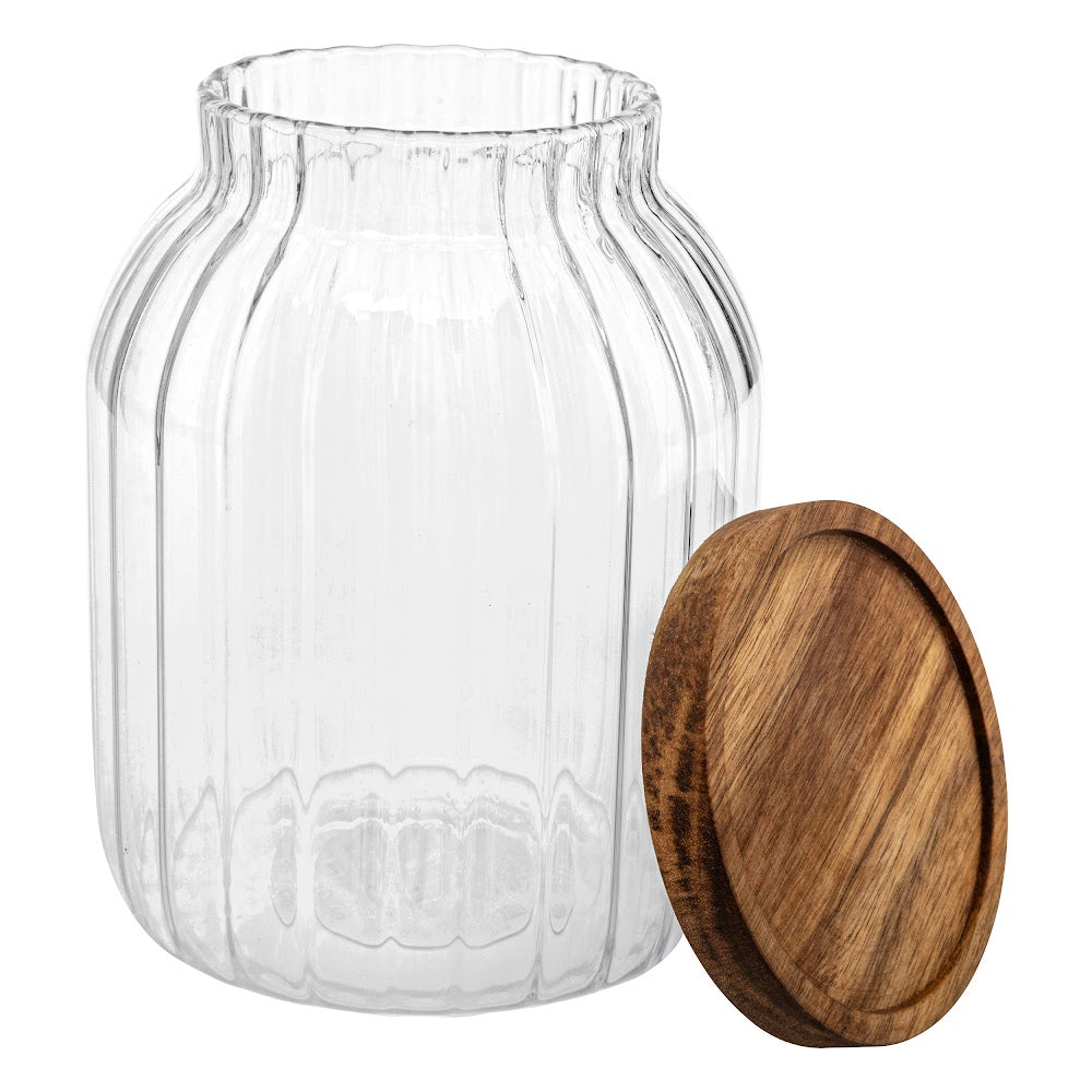 Gjennomsiktig oppbevaringsglass med tørrvare synlig