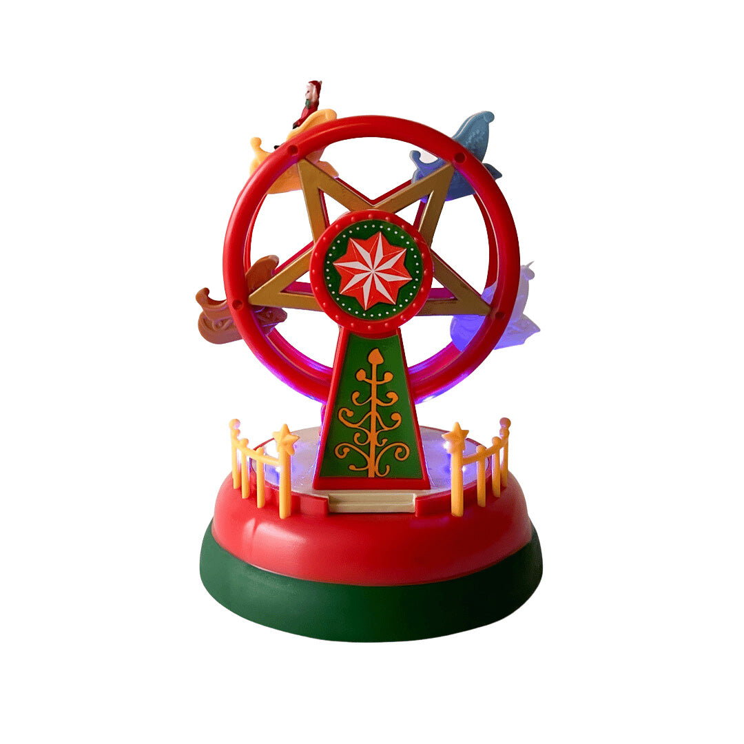 Juledekorasjon formet som pariserhjul, opplyst med lilla lys og pyntet med små julefigurer.
