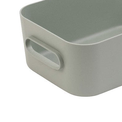 Liten grønn oppbevaringsboks med håndtak til skap og skuffer