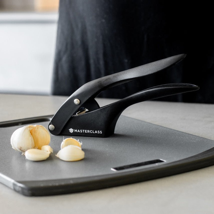 Ergonomisk vitlökspress med rustfria skärblad