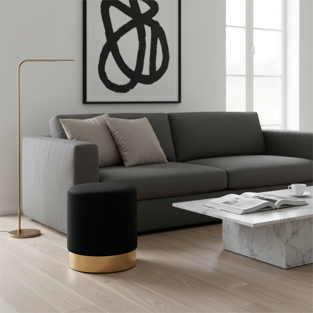 Kompakt sort puff med rund form og luksuriøs finish