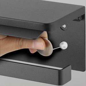 Toalettpapirholder med hylle i sort metall, veggmontert modell som tåler fukt og daglig bruk.