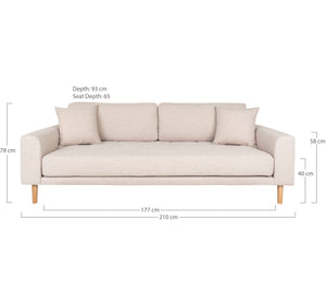 Moderne sandfarget sofa med rette linjer og faste puter. 