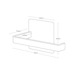 Person bytter dorull på sort magnetisk holder.