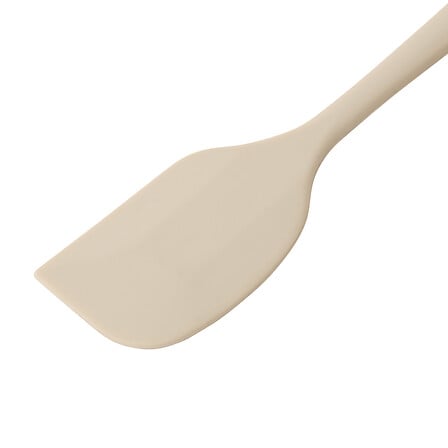 Nærbilde av det brede, myke silikonbladet på Essentials slikkepott i beige.