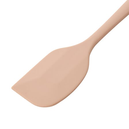 Nærbilde av det brede, myke silikonbladet på Essentials slikkepott i rosa.