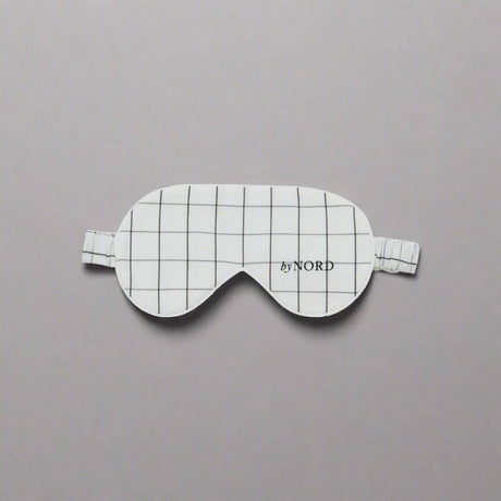 Sovemaske med ruter og elastisk stropp.
