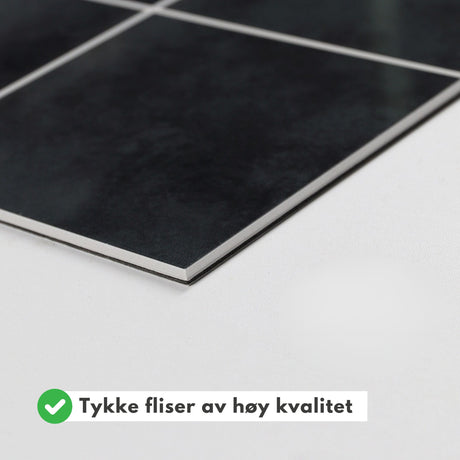 Selvklebende flis i antrasittgrå nyanse for vurdering av farge og tekstur.