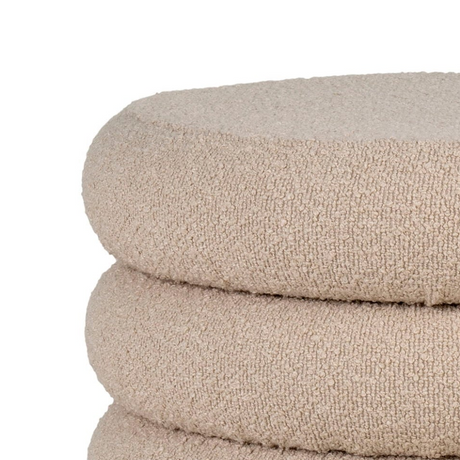 Rund beige puff med skjult oppbevaring og myk bouclétekstur