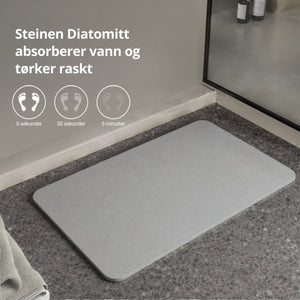 Grå diatomittmatte med informasjon om absorbering og hurtigtørking