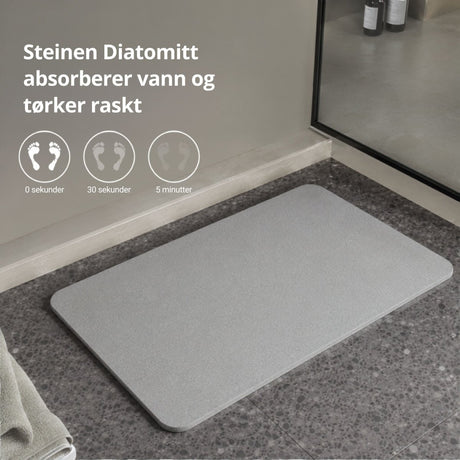 Grå diatomittmatte med informasjon om absorbering og hurtigtørking