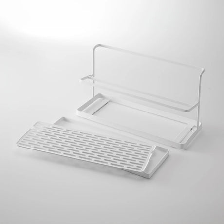 Tørkeløsning til drikkeflasker med skrå plassering og avtakbar rist