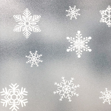 Återanvändbar julfolie med snökristaller som används på fönster