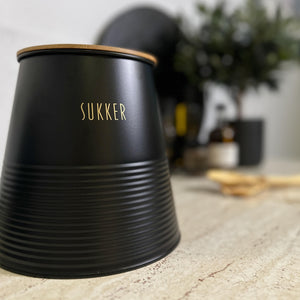 Boks sukker, sort metall